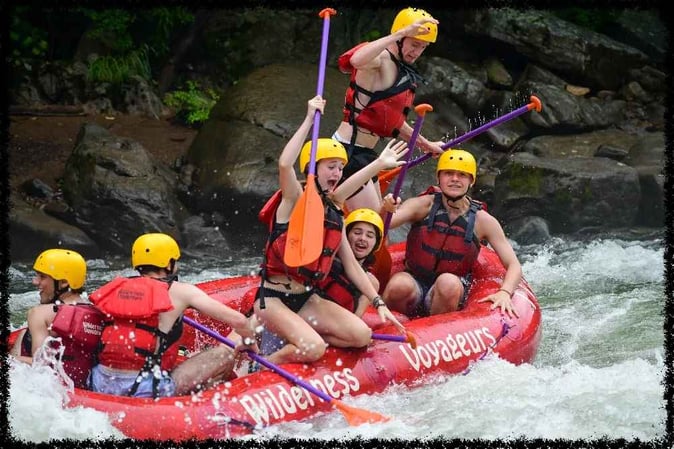 A group of Campers White Water Rafting 
