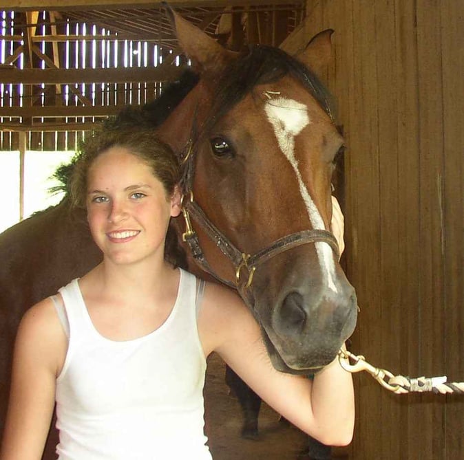 Picture of a female Camper with a horse