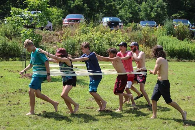 A group of Campers playing a game that teaches teamwork