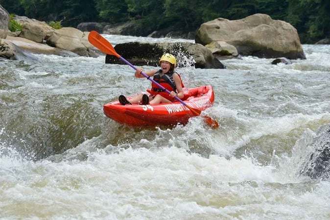 picture of a Camper White Water Rafting.