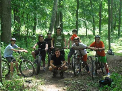 A group of Teen Campers pose for a picture on their bikes