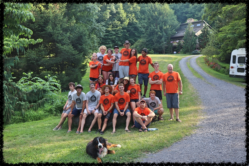 Director Jud with some Campers and Staff in SMA T-Shirt pose for a group picture