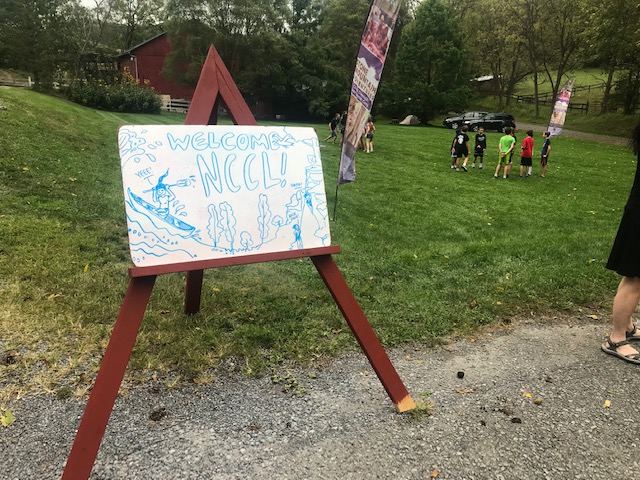 Picture of a Board welcoming NCCL students to camp