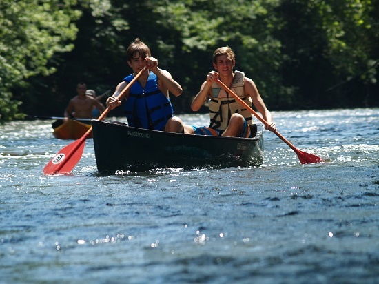 Picture of 2 male Campers canoeing 