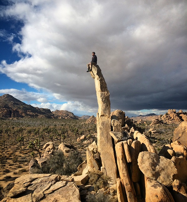 Picture of Jason sitting on a rock