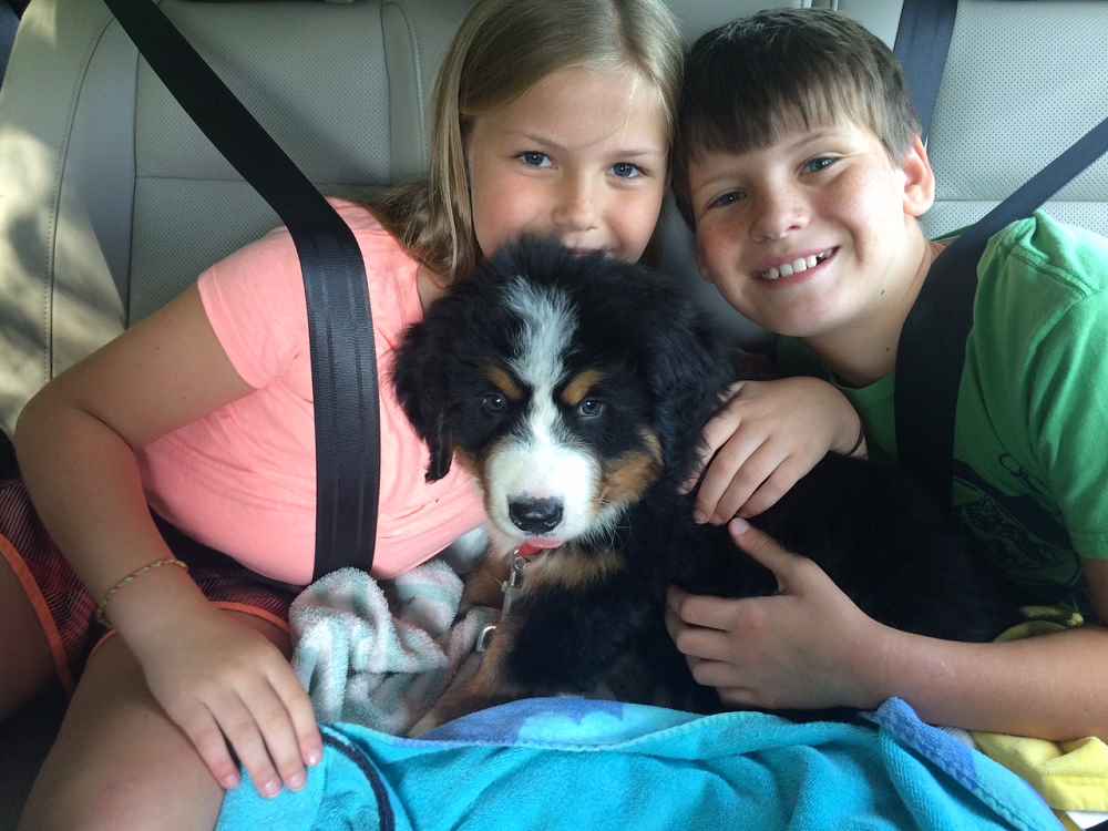 2 Teen Campers pose for a photo with their dog