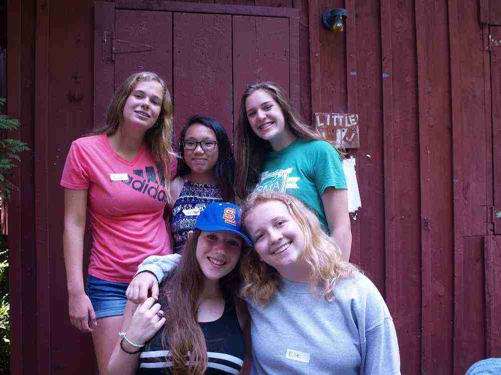 A group of Teen female Campers pose for a picture.