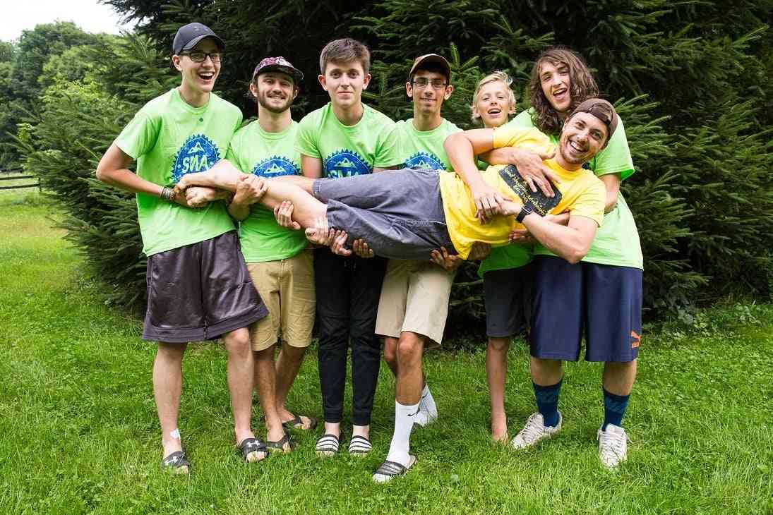 A group of Campers in SMA T-Shirt pose for a picture.